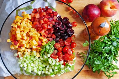 Summer stone fruit salad ingredients in a bowl