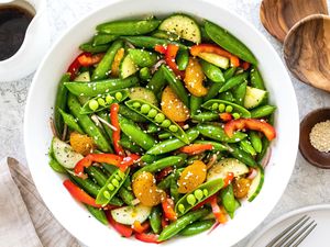 Spring snap pea salad in large serving bowl.