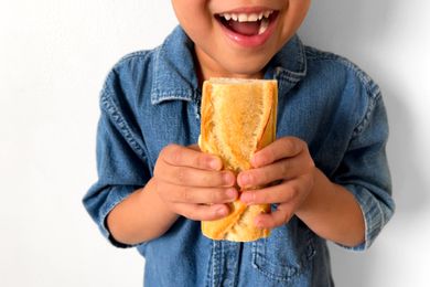 Kid with French baguette