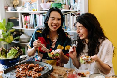 Two woman enjoying Korean BBQ