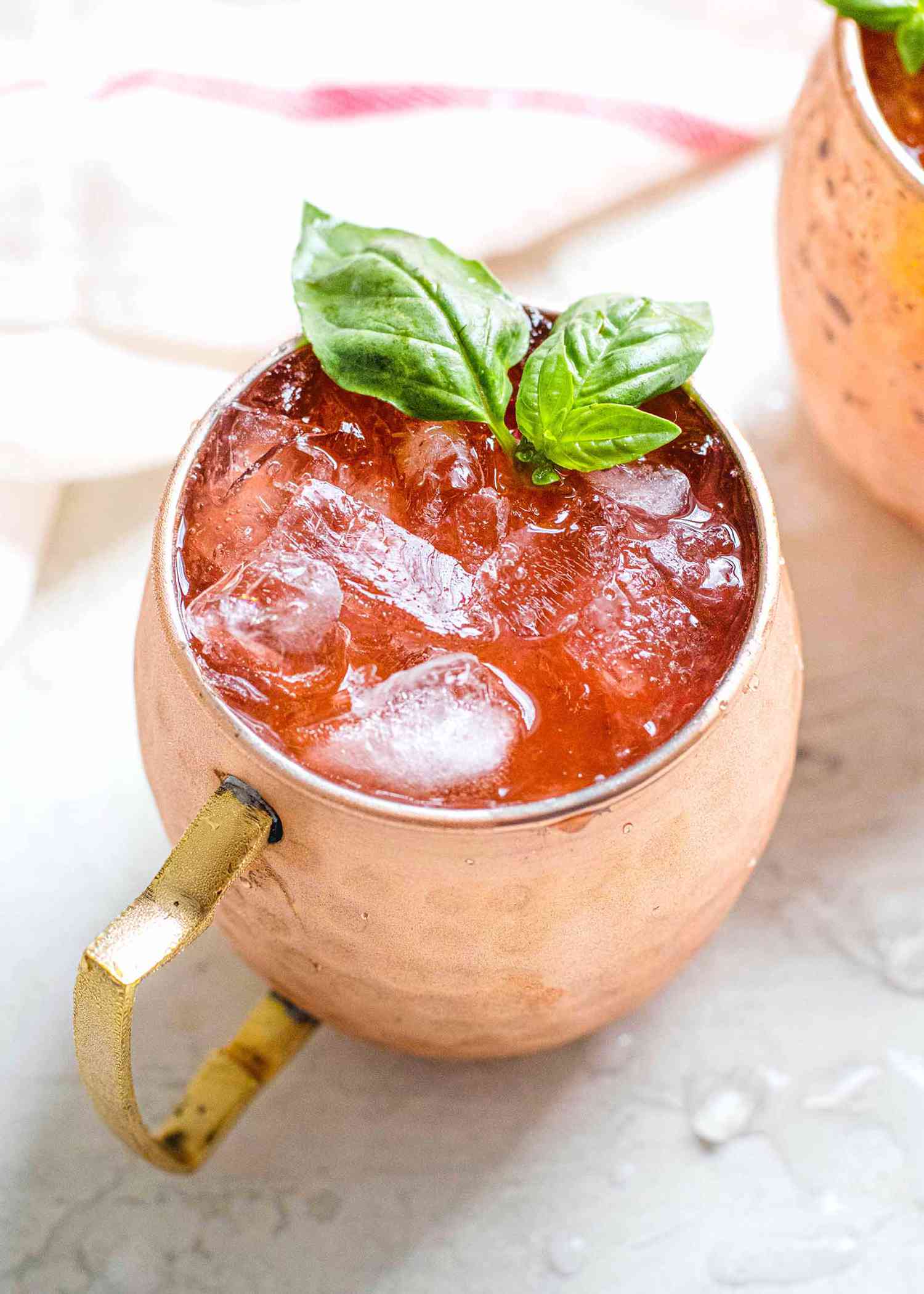 Strawberry-Basil Moscow Mule - closeup strawberry moscow mule in copper mug