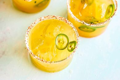 Two margaritas in glasses with Pineapple and Jalapeno