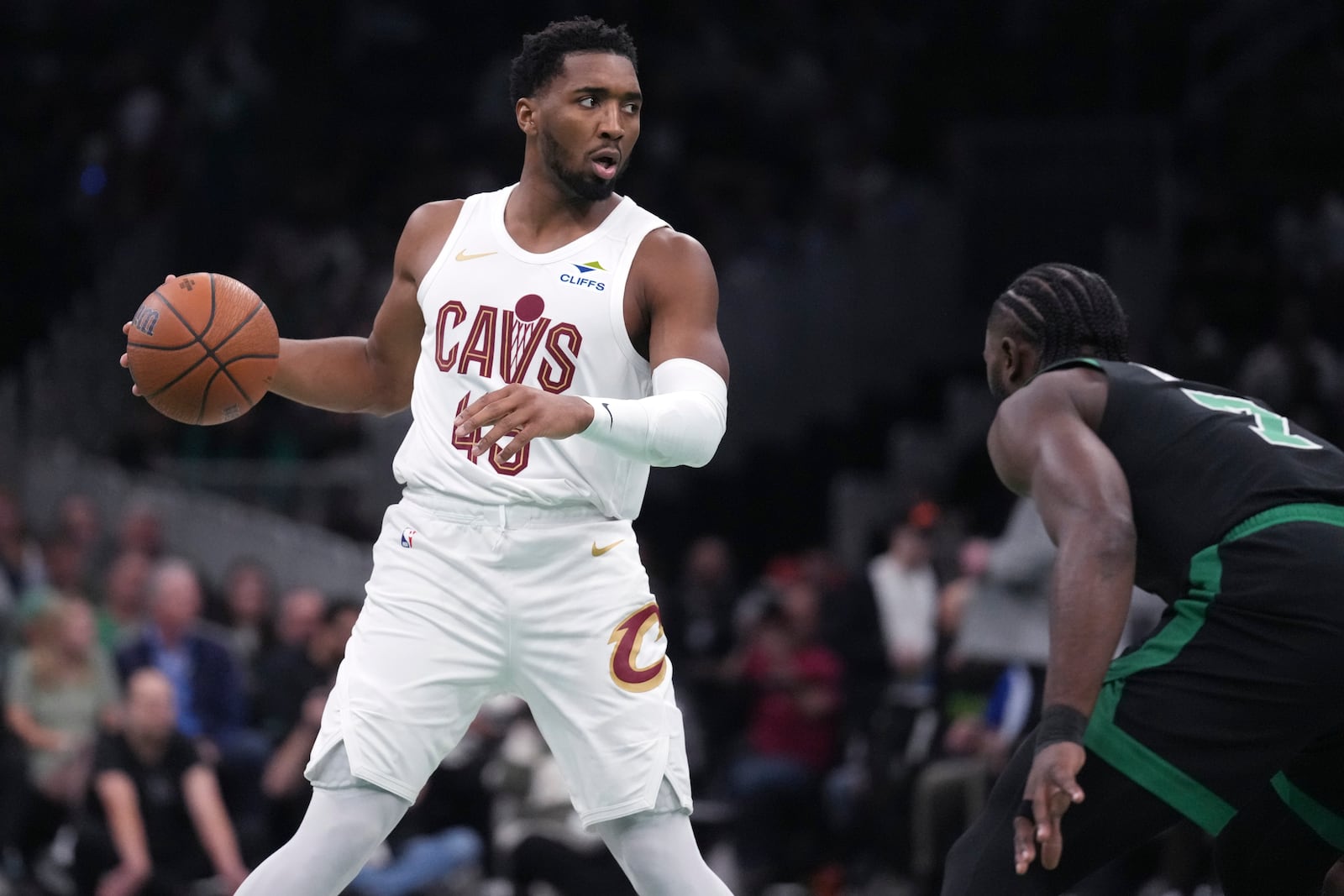 Cleveland Cavaliers guard Donovan Mitchell (45) sets to drive against Boston Celtics guard Jaylen Brown (7) during the first half of an Emirates NBA Cup basketball game, Tuesday, Nov. 19, 2024, in Boston. (AP Photo/Charles Krupa)