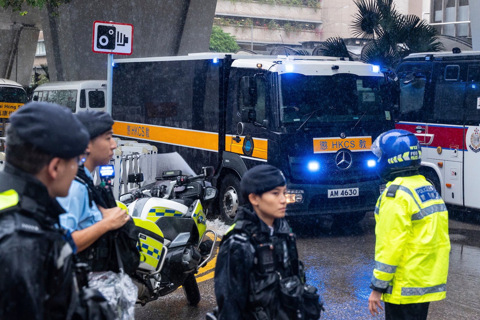 A Correctional Services Department vehicle arrives at the West Kowloon Magistrates' Courts in Hong Kong, Wednesday, Nov. 20, 2024, ahead of Hong Kong activist publisher Jimmy Lai's national security trial. (AP Photo/Chan Long Hei)