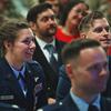 Capt. Lacie Hester, left, and Maj. Benjamin Coffey, right, watch the closing of an award ceremony at RAF Lakenheath in England on Nov. 12, 2024. Each received a Silver Star. 