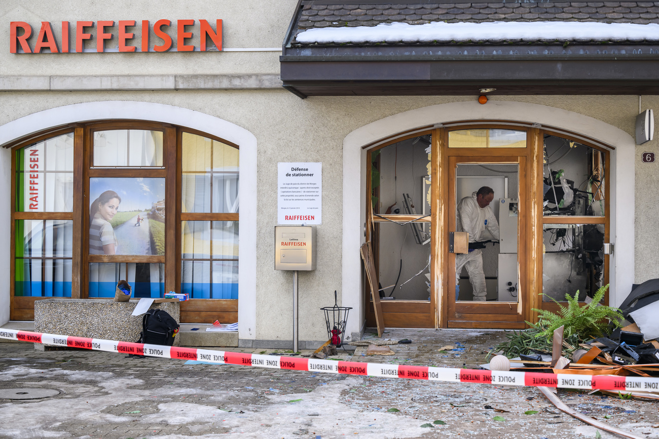 Police investigate an ATM explosion at Biere, Switzerland, in February 2023.