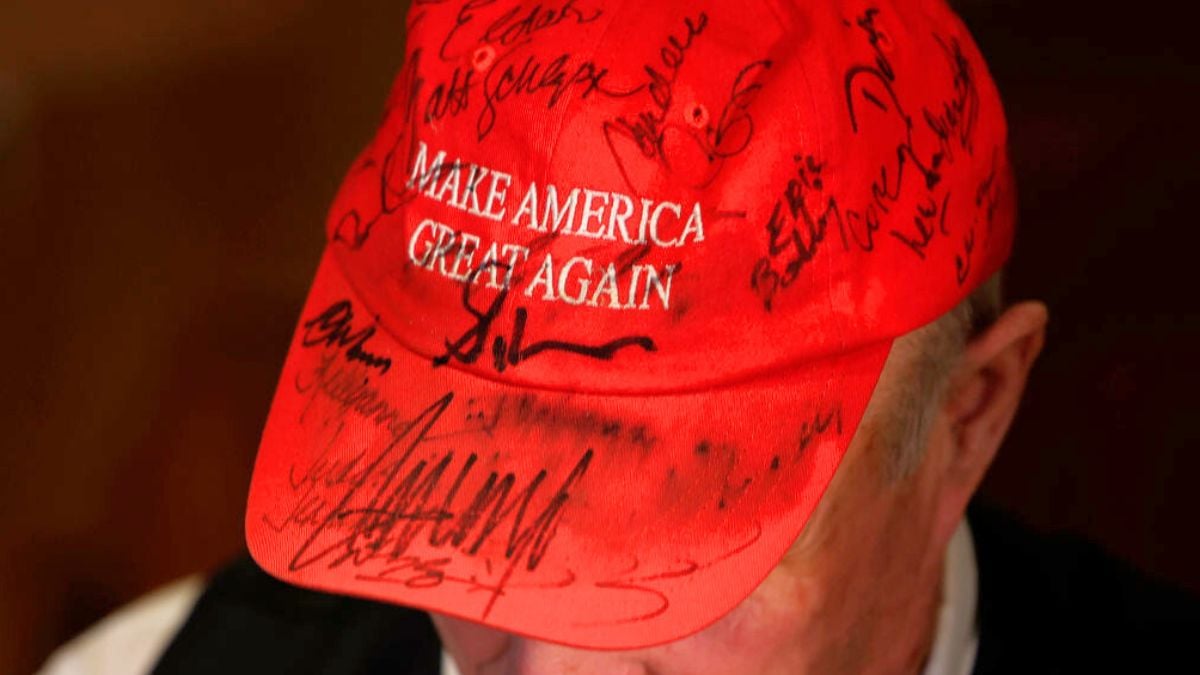 URBANDALE, IOWA - JANUARY 11: A supporter of former President Donald Trump wears an autographed MAGA hat during an event with Donald Trump Jr. hosted by the Bull Moose Club at The Machine Shed restaurant on January 11, 2024 in Urbandale, Iowa. The politically conservative club hosted Trump, who is stumping for his father, former President Donald Trump, four days ahead of the Iowa caucuses. (Photo by Chip Somodevilla/Getty Images)