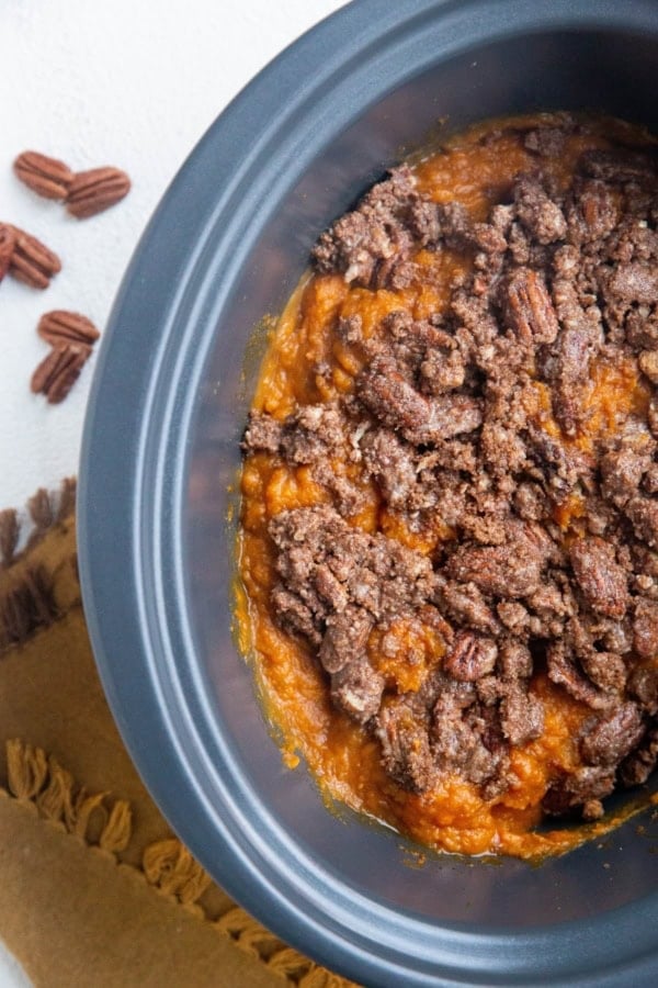 Top down photo of whole crock pot with slow cooker sweet potato casserole inside.