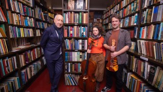 Pete Townshend with Beth Porter and Ben Please, the duo who are the Bookshop Band from Wigtown