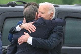 President Biden embraces his son at Delaware Air National Guard Base after flying out to see him on Tuesday