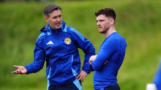 Robertson, right, watches from the sidelines during training