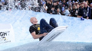 Mack Horton, the Olympic gold medal-winning Australian swimmer, takes part in Big Freeze 10 — an event that raises money for the charity FightMND with the purpose of finding a cure for motor neurone disease — during a break in the Australian rules football match between Collingwood Magpies and Melbourne Demons at Melbourne Cricket Ground. After retiring from competitive sport this year, Horton became the president of the Australian Swimmers’ Association