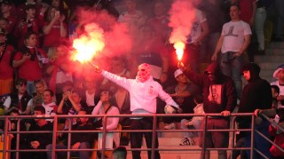 Serbian fans at a friendly against Austria on Tuesday last week. They have a reputation for setting off flares during matches and clashing with police and security teams