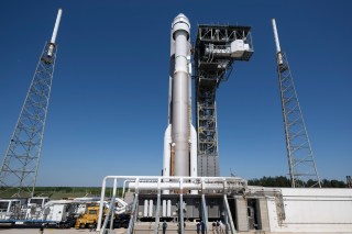 The Starliner spacecraft, aboard a United Launch Alliance Atlas V rocket, is rolled out to the launchpad at Cape Canaveral