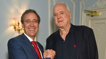 Miguel Berger, left, with John Cleese, who says he has had a warm reception from German audiences