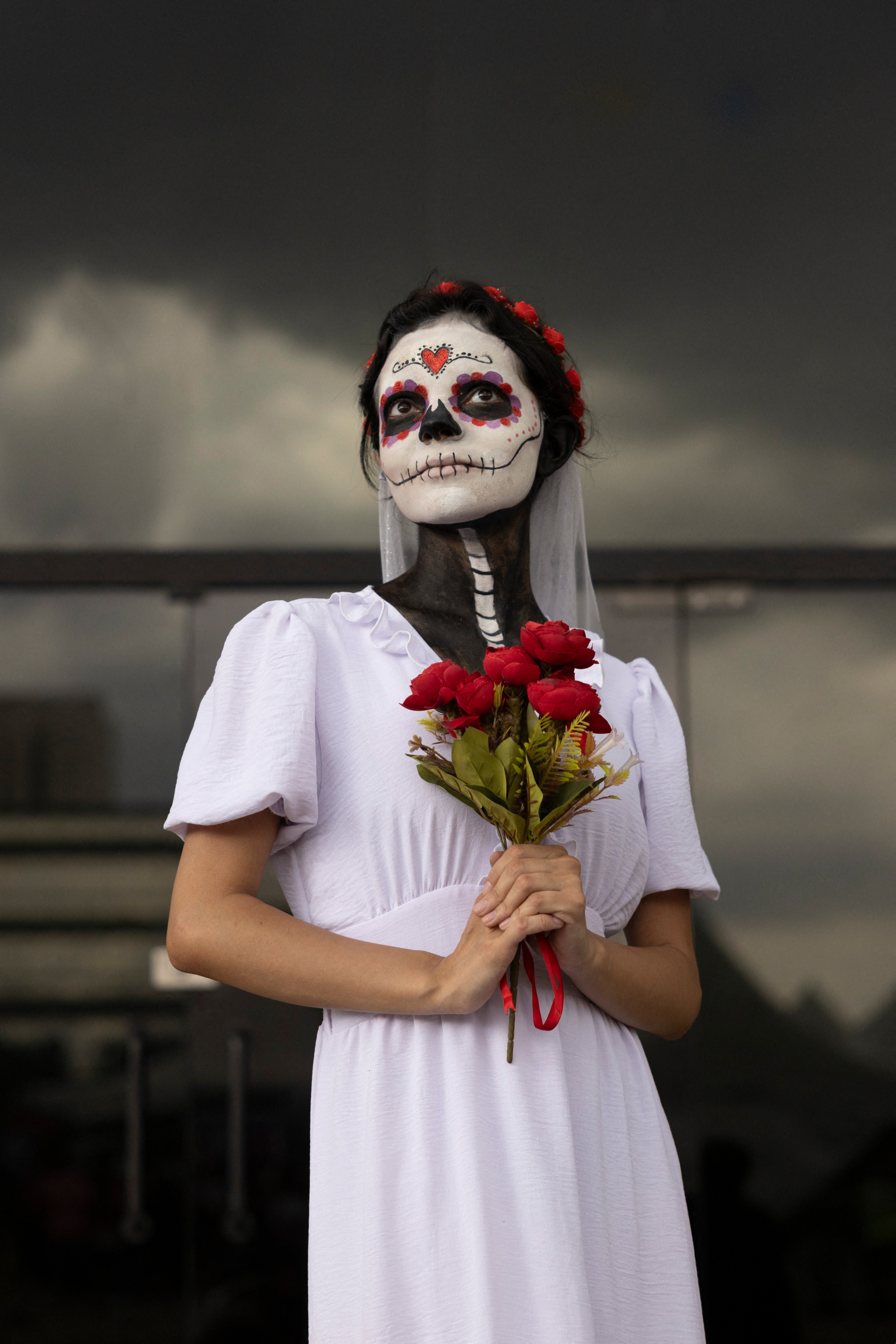 A disguised visitor takes part in the Día de Los Muertos festival in Sao Paulo, Brazil, on Saturday. The holiday involves family and friends gathering to pay their respects to loved ones who have died