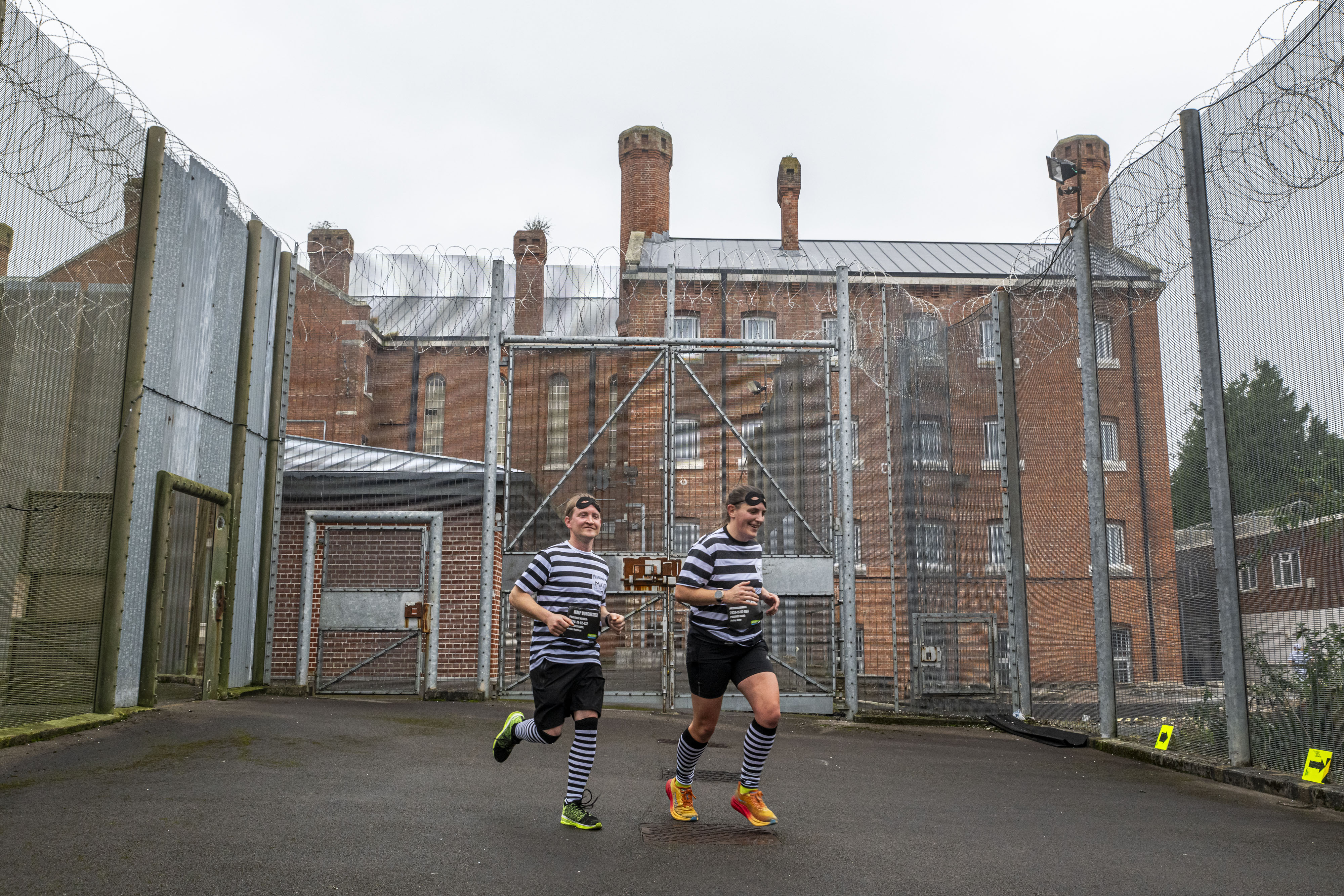 Two “inmates” take part in the UK’s only marathon run entirely inside a prison. The run comprises 55 laps around the corridors, gangways and prison yards of a Victorian former jail in Dorchester, Dorset. Some 135 runners took part