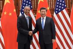 Chinese President Xi Jinping shakes hands with Barack Obama