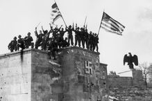 U.S. Soldiers on a Nazi monument on V Day in Germany