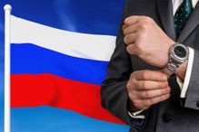 Business in Russia. Businessman on national flag background.