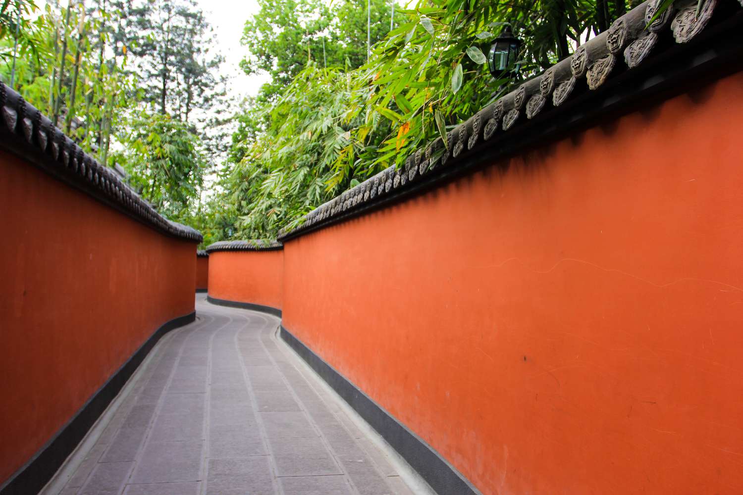 Chinese alley with red wall and green bamboo grove,Chengdu,Sichuan Province,China