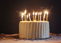 Birthday cake with candles and sparklers.