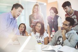 Professor talking to students in classroom