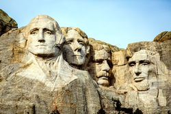 Mount Rushmore features 60-foot-tall sculptures of the faces of George Washington, Thomas Jefferson, Teddy Roosevelt, and Abe Lincoln