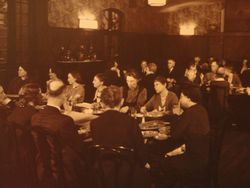 Residents of Hull House in the dining room, about 1920