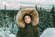 Girl with fur hood during winter