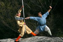 Shaolin monks train in both empty-hand kung fu and weapons fighting.