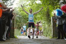 Runner being cheered at the finish line