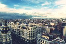 High Angle View Of Cityscape Against Cloudy Sky