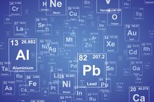 Graphic rendering of the periodic table of elements on a blue background.