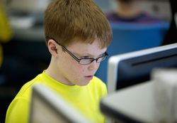 Sixth grader in computer lab at school