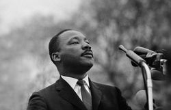 MONTGOMERY, AL - MARCH 25: Dr. Martin Luther King, Jr. speaking before crowd of 25,000 Selma To Montgomery, Alabama civil rights marchers, in front of Montgomery, Alabama state capital building. On March 25, 1965 in Montgomery, Alabama.