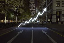 A photo illustration of a line graph in the middle of the street