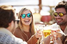 Friends toasting each other with wine