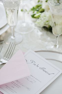 Wedding invitation on table setting, studio shot