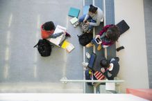 Overhead view high school students studying hanging out