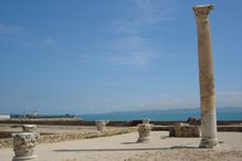 Column at an excavation site on sunny day.