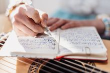 woman writing in notebook