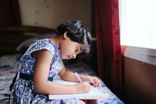 Girl writing in notebook