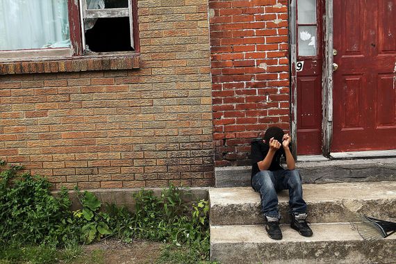 A child living in poverty in de-industrialized Utica, NY symbolizes the socio-economic causes and consequences of poverty.