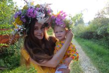 Portrait Of Young Woman With Baby Girl Wearing Flowers On Hair At Field - stock photo Photo Taken In Yegor'yevsk, Russia