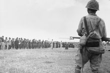 Filipino and American troops waiting in formation