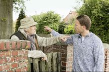 Senior man and younger man arguing