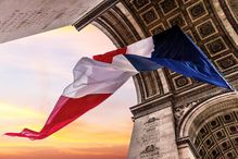 A French flag flies under the Arc de Triomphe in celebration of Armistice Day, November 11th.