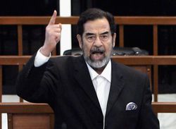 Former Iraqi President Saddam Hussein shouts as he receives his guilty verdict during his trial on November 5, 2006 in Baghdad, Iraq.