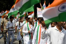 People holding Indian flags during the tri-colour march